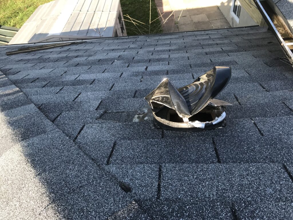 raccoon removal and repair roof vents, Raccoon damage to a metal roof vent.